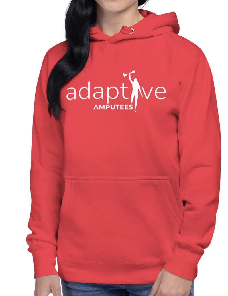 Woman wears red hoodie with adaptive amputees logo